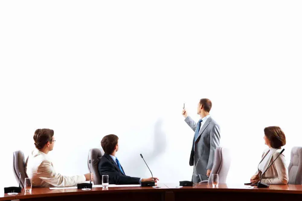 Image of businesspeople at presentation looking at screen. Space for advertisment